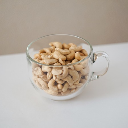 cashew nuts in a mugの写真素材