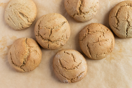 Homemade oatmeal cookies on kraft baking paperの写真素材