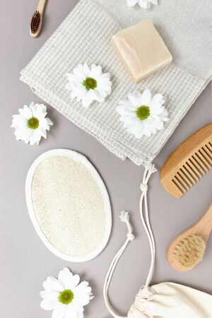 White chamomile, accessories for personal hygiene. Zero waste composition on gray background.の写真素材