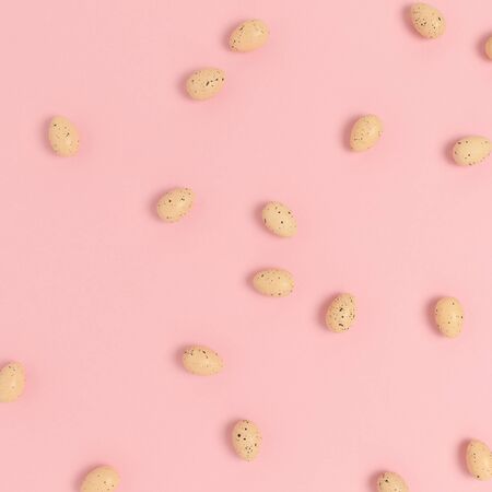 Pattern made of easter eggs on a pink pastel background. Holiday creative concept.