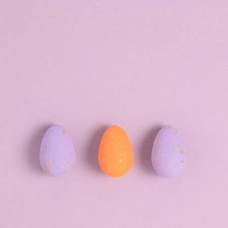 Layout of easter eggs on a purple pastel background. Holiday concept.の写真素材