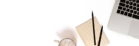 Banner with laptop, mug of coffee and stationery on a white background. Minimalist workspace...