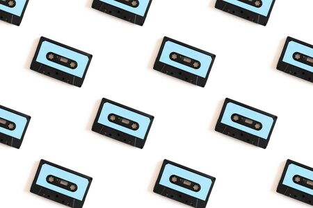 Cassette tapes pattern on a white background. Creative layout.