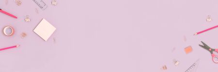Top view of various stationery on a purple pastel background. Back to school concept banner with place for text.の写真素材