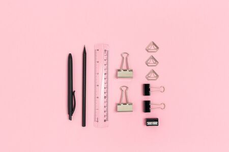 Set of black office supplies on a pink pastel background. Stationery layout.の写真素材