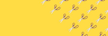 Scissors pattern on a yellow background. Office supplies layout.の写真素材