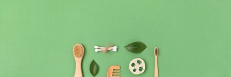 Layout of zero waste accessories for personal hygiene on a green pastel background. Banner with plastic free concept.の写真素材