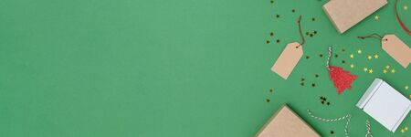 Banner with equipment for Christmas gift wrapping on a green background. Festive frame with copy space.の写真素材