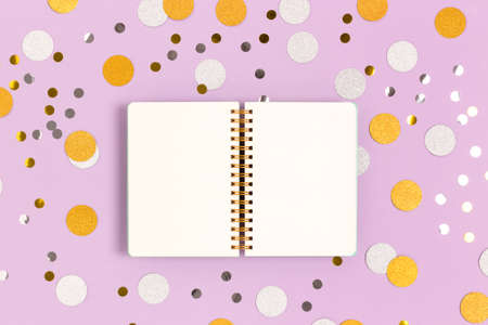 Blank copybook mockup on a purple pastel background. Round confetti texture. Festive shiny concept.