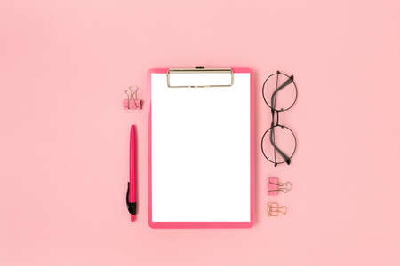 Layout with clipboard mockup and stationery on a pink background. Cute back to school concept.の写真素材