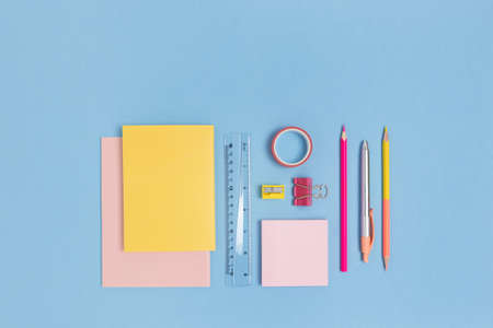 Group of colorful school supplies on a blue pastel background. Stationery creative concept.の写真素材