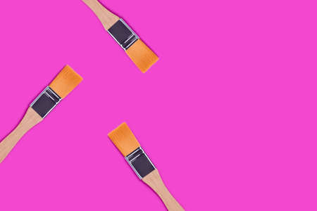 Paint brushes on a purple background. Artistic creative concept.の写真素材
