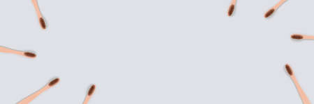 Frame made of toothbrushes on a blue background. Zero waste banner with copy space.の写真素材