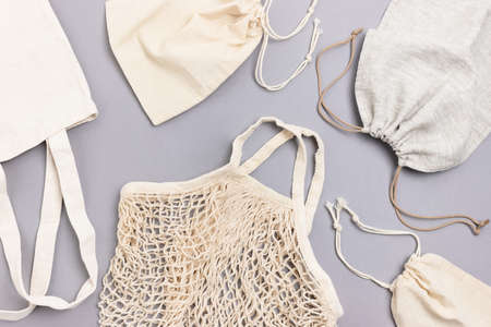 Reusable shopping bags on gray background. Zero waste composition.の写真素材