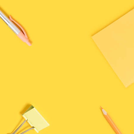 Cute school equipment on a yellow background. Monochrome composition with place for text.