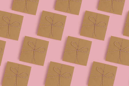 Gift boxes pattern on a pink pastel background. Holidays composition.