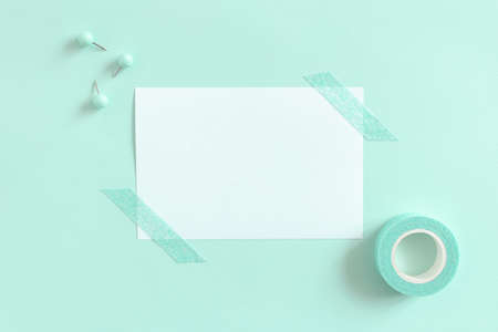 White paper mockup and set of mint stationery