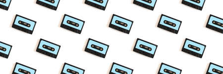 Cassette tapes pattern on a white background. Creative banner concept.の写真素材