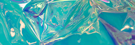 Blue iridescent blurred hologram banner. Crumpled foil material. Creative template with place for text.の写真素材