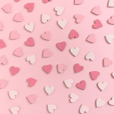 Pattern made of hearts on a pink background