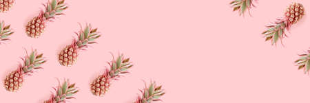 Header with trendy repetitive pattern made of pink pineapples. Summertime concept with copy space.