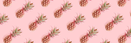 Header with trendy repetitive pattern made of pink pineapples. Summertime concept.の写真素材