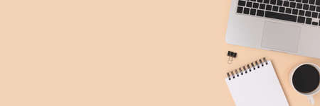 Banner with laptop, coffee and stationery on a beige background. E-learning, online education...