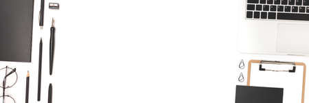 Banner with laptop and stationery on a white background. Workspace for distance education with place for text.の写真素材