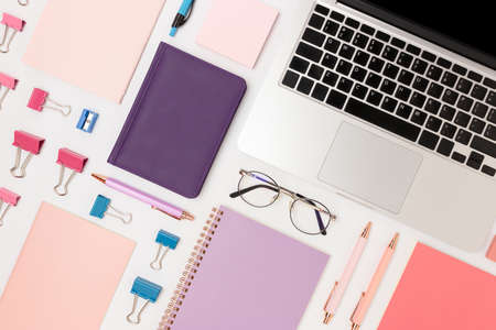 Layout of office supplies and laptop on a white background. Neat equipment concept.の写真素材