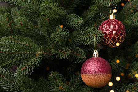Festive concept with red Christmas decorations. New Year baubles with copyspace.