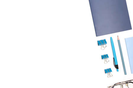 Layout of blue office stationery on a white background. Neat workspace with place for text.