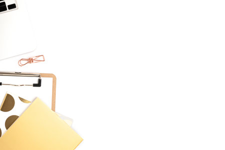 Office supplies and laptop on a white background. Business workspace with place for text.