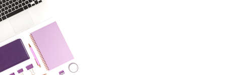 Banner with laptop and purple stationery on a white background. Neat workspace for homeschooling.の写真素材