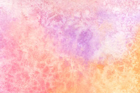 Colorful watercolor texture. Abstract hand-drawn background in pastel pink, yellow and purple colors.の写真素材
