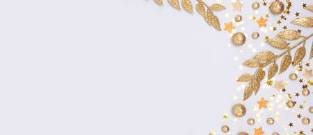 Banner with frame made from golden glittering decorations on a blue background.の写真素材