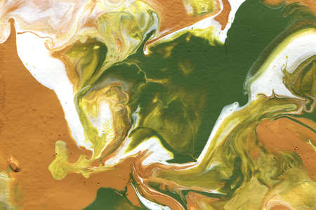 Acrylic texture made in fluid pour technique. Background in earthy colors with gold glittering paints.の写真素材