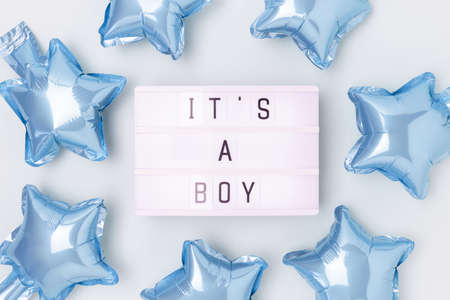 Its a boy - quote. Frame made of blue star foil balloons and lightbox.