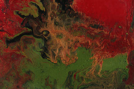 Acrylic texture made in fluid pour technique. Background in red and green colors.