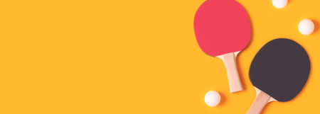 Banner with tennis rackets and white balls on a yellow background.