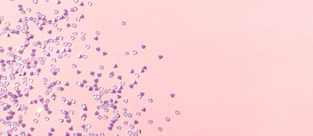 Banner with tiny silver crystal confetti on a pink pastel background. Glowing concept with place for...