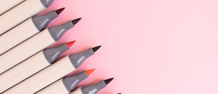 Banner with felt tip pens on a pink background. Creative composition with place for text.の写真素材