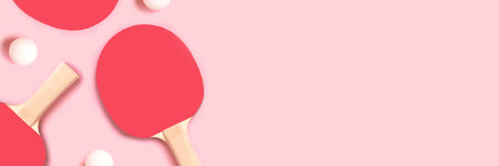 Banner with tennis rackets and white balls on a pink background. Panoramic composition with place for text.の写真素材