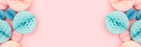 Banner with frame made of tissue paper balls different sizes in a blue and pink colors. Place for...