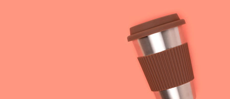 Banner with reusable coffee cup on a coral colored background. Place for text.の写真素材