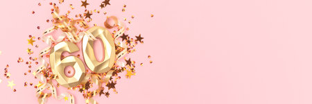 Banner with golden number 60, ribbons and stars confetti on a pink background. Festive concept with...
