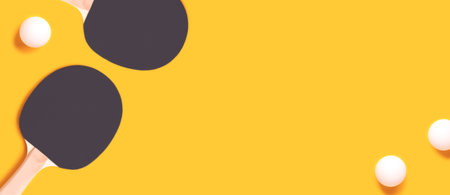 Banner with tennis rackets and white balls on a yellow background.の写真素材