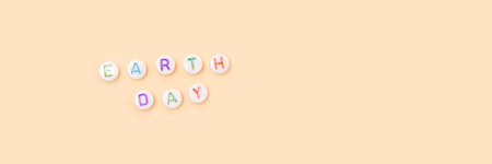 earth day. Banner with quote made of beads with letters on a beige background.の写真素材