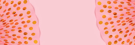 Banner with frame made of paper fans with golden dots on a pink background. Festive concept.の写真素材