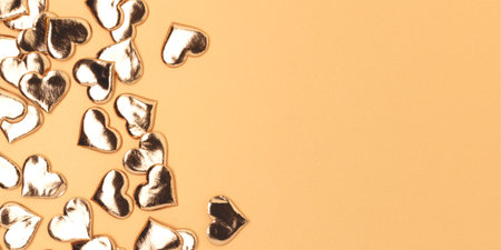 Banner witth golden shiny hearts confetti. Composition with place for text.の写真素材