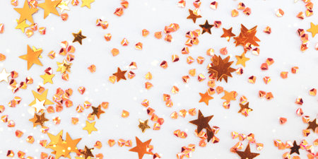Banner with shiny golden stars and crystals confetti on a blue background. selective focus.